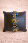 Hand-inlaid medallion bracelet with lapis and crimson stone accents for bridal and festive occasions - Ahmad K Collections